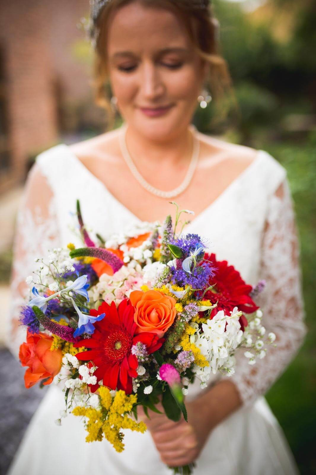 Leicestershire wedding, bride with bright summer bouquet